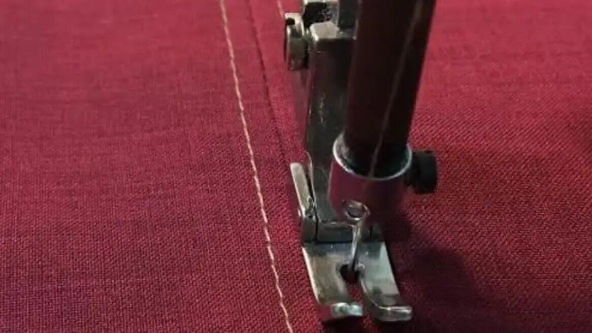 Hands stitching fabric